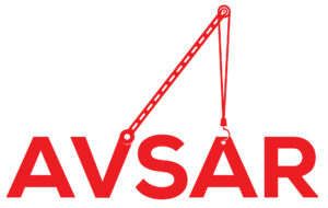 Red crane lifting AVSAR letters.